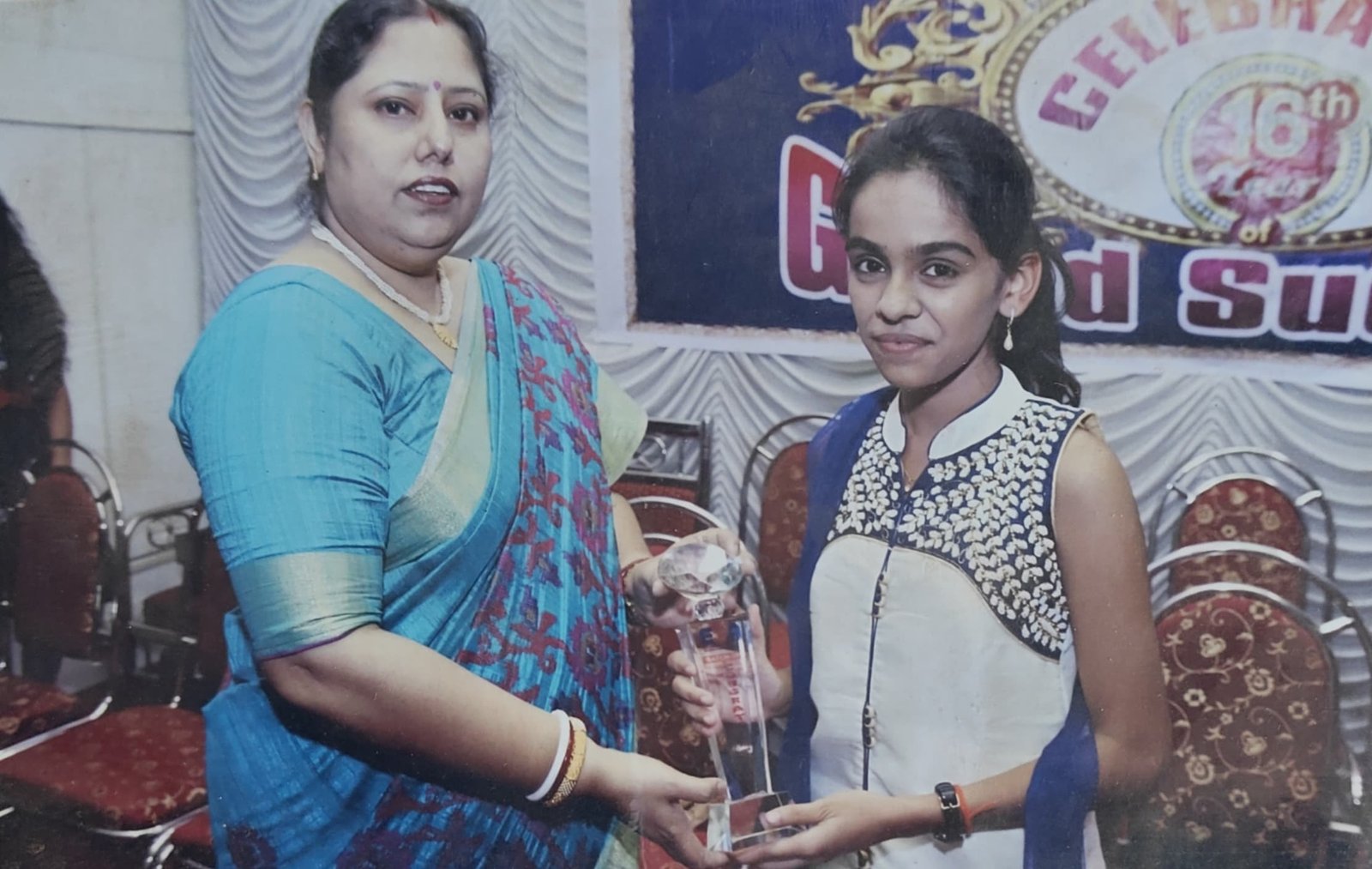 Winner with teacher during the success celebration