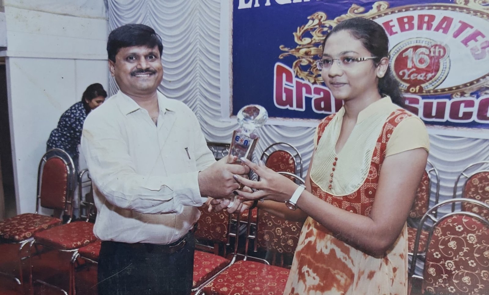 Trophy handover at the grand success celebration