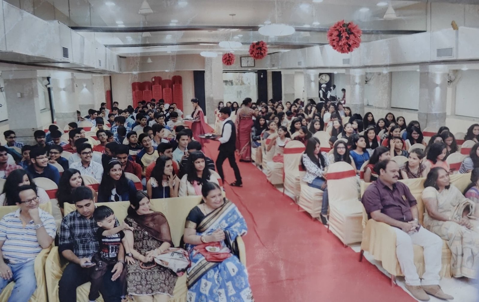 Packed audience of students and parents at the felicitation