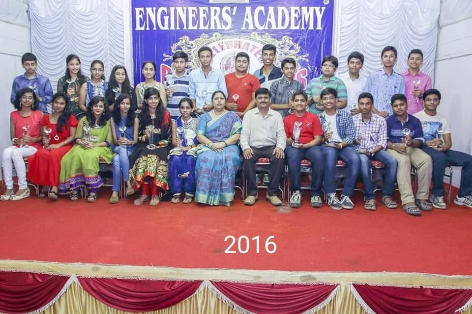 2016 felicitation — medal winners seated with the academy team